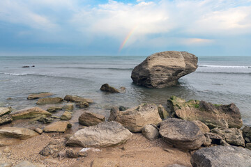 Fototapeta na wymiar Rocky sea beach with boulders