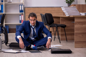 Young male businessman employee unhappy with his work