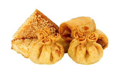 Group of Chinese appetizers including vegetable spring rolls, wontons and prawn toast isolated o a white background