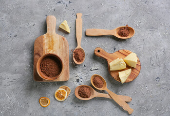 Fototapeta na wymiar Cacao powder with butter on grey background