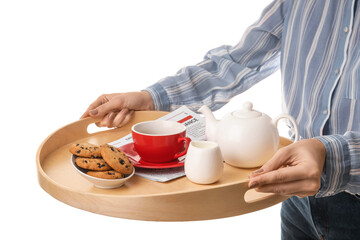 Woman holding tray with tasty breakfast on white background, closeup