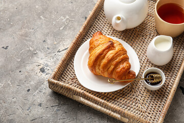 Tray with tasty breakfast on dark background