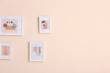 Beautiful pictures hanging on color wall