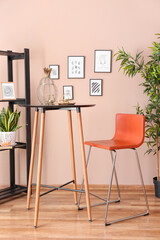 Stylish interior of living room with beautiful pictures