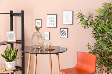 Stylish interior of living room with beautiful pictures