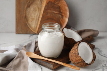Jar of tasty coconut yogurt on table