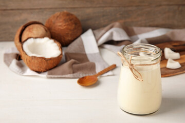 Jar of tasty coconut yogurt on table