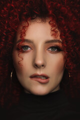 White European girl with afro curls, beautiful casual makeup. Large portrait of a girl with red hair