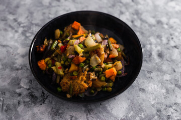 vegan roast with mixed vegetables and mock meat, healthy plant-based food