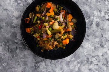 vegan roast with mixed vegetables and mock meat, healthy plant-based food
