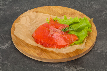 Sliced salmon fillet served rosemary