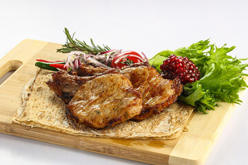 Grilled pork loin served onion