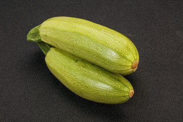 Young tasty zucchini over board