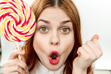 cheerful pretty woman with big multicolored lollipop smile sweets dessert