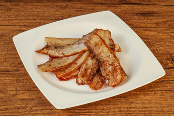 Roasted juicy bacon in the plate