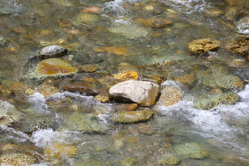 Stones in a stormy mountain river