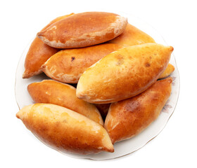 Pies with cabbage in a plate isolated on a white background.
