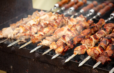 Meat on skewers is fried
