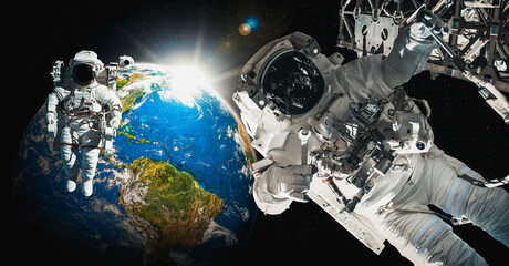 Astronaut spaceman do spacewalk while working for space station in outer space . Astronaut wear full spacesuit for space operation . Elements of this image furnished by NASA space astronaut photos. © InfiniteFlow