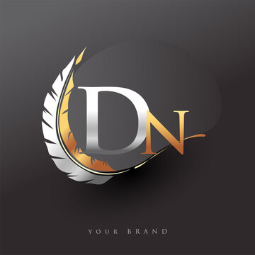 Initial letter DN logo with Feather Gold And Silver Color, Simple and Clean Design For Company Name. Vector Logo for Business and Company.