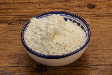 Wheat flour heap in the bowl