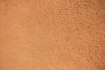 plaster texture of the outer wall of the building, teracotta red texture wall for backgrounds and copy space