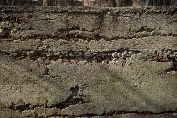 stone with cartridges and casings, cement wall with casings, fragment of a monument dedicated to...