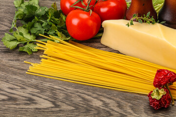Raw Italian spaghetti heap with cheese