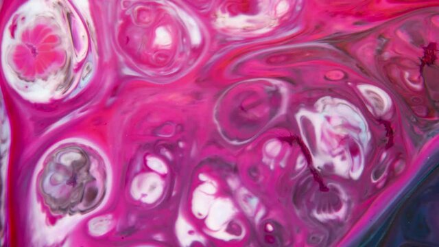Abstract Colors in a moving video background. Multicolored beautiful oil paints in fantastic motion. Chaotic Movement of bubbles in a dark background.