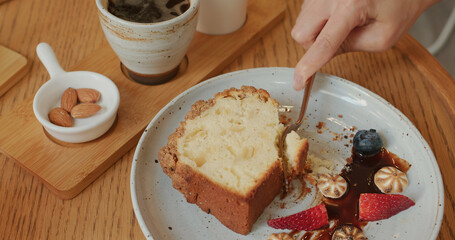 Cake with hot coffee in cafe
