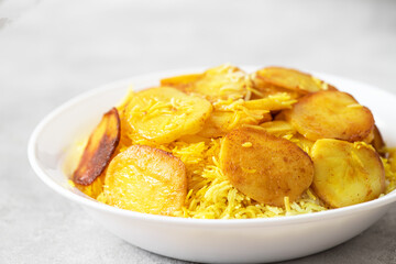 Maqluba, arabic national dish- rice with potato crisp