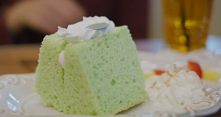 Slice of pandan cake in coffee shop