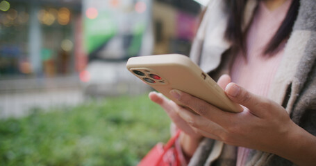 Woman use of mobile phone at street