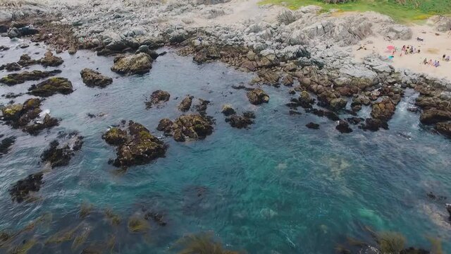 Aerial shot with drone over the beach of Punta de Tralca chile, cinematic video and stabilized away from the beach