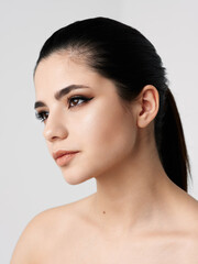 brunette face makeup naked shoulders clear skin close-up