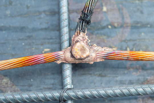 Welding copper ground wire on ground rod.Welding copper ground wire.Connect copper grounding lightning protection system. With the melting