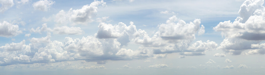 blue sky background with tiny clouds. panorama white fluffy clouds in the blue sky.Beautiful vast blue sky with amazing cloud background.Wide sky panorama with scattered cumulus clouds.