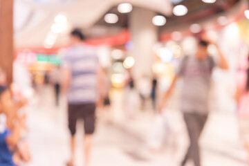 Abstract defocused or blurred background of the shopping mall with nice department store interior. which including of people and shop store.