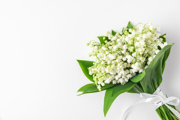 Lily of the valley flowers on white background. Wedding concept. flat lay, top view with copy space