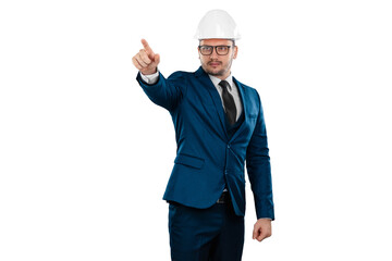 A man in a business suit, an architect with a white helmet on his head points his finger at something, isolated on a white background. Architecture, construction concept.