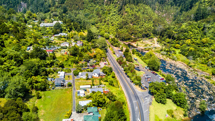 Fototapeta na wymiar The road running across a mountain river in a beautiful little valley. Coromandel, New Zealand.