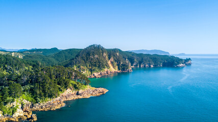 Aerial view of a beautiful harbour with rocky coastline. Coromandel, New Zealand.