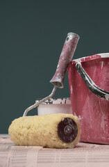 Paint roller and bucket with paint drops © stokkete