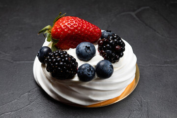 The Pavlov dessert with white cream and fruits