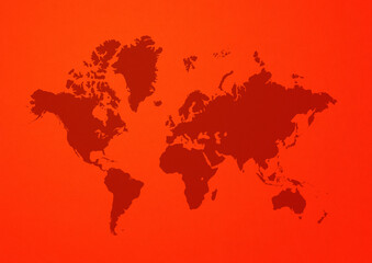World map on red wall background