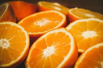 Bunch of fresh sliced oranges on a tray