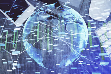 Double exposure of business theme hologram over desktop with phone. Top view. Mobile international trade connection concept.