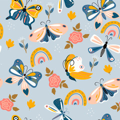 Fototapeta premium Seamless pattern of butterflies and rainbows in boho style. Vector graphics.