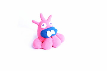 Hand made figurines, funny creatures made of plastic mass, modeling clay. Fancy, colorful characters.