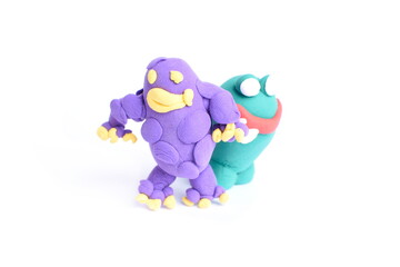 Hand made figurines, funny creatures made of plastic mass, modeling clay. Fancy, colorful characters.